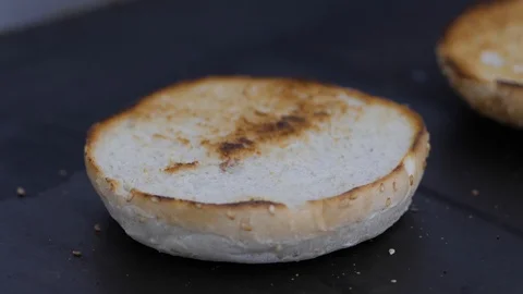 Burger buns toasted on the grill. Preparing of the burger Stock Footage 86178622