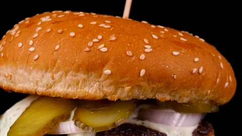 Burger, camera moves from bottom to top, burger with pickled cucumbers and sauce Stock Footage 84652882