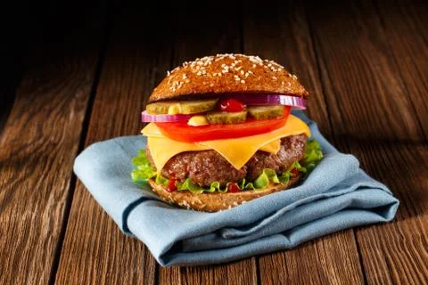 Burger with cheese close up. Stock Photos