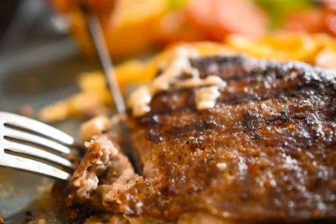 Burger with cheese inside close up image. Stock Photos
