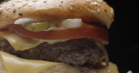 Burger close-up rotating in studio. Tasty fast food. Stock Footage 144798660