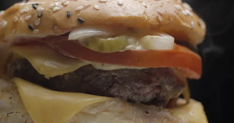 Burger close-up rotating in studio. Tasty fast food. Stock Footage 144798862