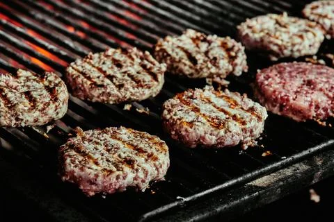 Burger cutlets on a grill - cutlets made from organic beef. raw cutlets. close Stock-Fotos