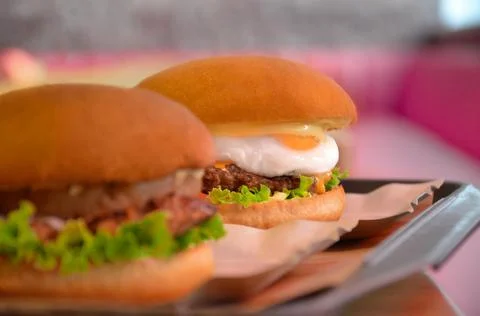 Burger with egg Stock Photos