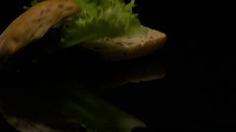 The Burger falls in slow action on the table Stock Footage 80427708