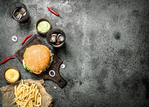 Burger from fresh beef with cola and fries. Stock Photos