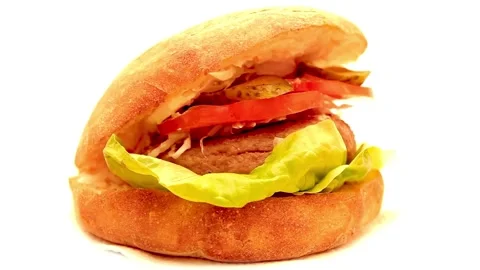 Burger with fresh iceberg cabbage, Macro background. Close-up view, fast food, Stock Footage 336579072