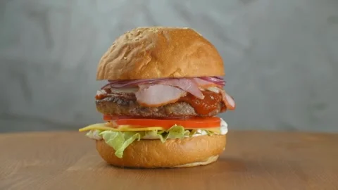Burger with fresh iceberg cabbage, Macro background. Close-up view, fast food, Stock-Footage 336579395