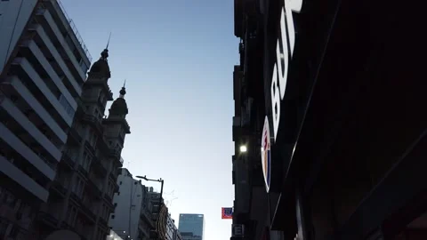 Burger King, hamburger chain store entrance logo over sunset downtown city Stock Footage 299687789