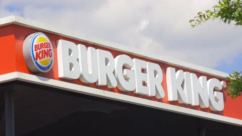 Burger King logo at the front of the fast food restaurant Stock Footage 153463819