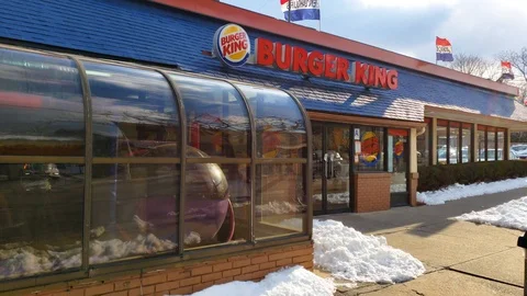 Burger King storefront tracking shot Stock Footage 104455619