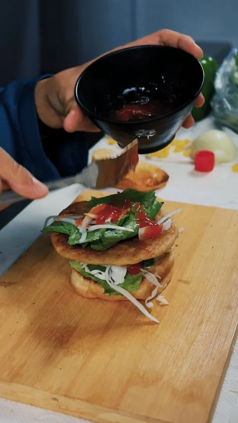 Burger in the making for dinner. Stock Footage 284053223