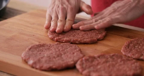 Burger making - minced steak molding, close-up Stock Footage 107947723