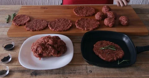 Burger making, molding rounded minced steak Stock Footage 107956125