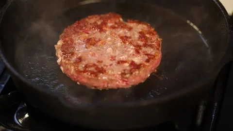 Burger meat fried on a pan Stock Footage 133439398