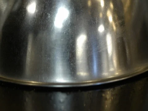 Burger patty with cheese slice being fried on commercial griddle in kitchen 動画素材 73548574