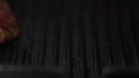 A burger patty is turned in a pan Stock-Footage 147626003