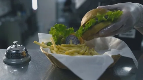Burger on a plate with garnish close-up Stock-Footage 73760360