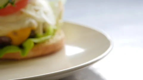 Burger on a plate, slow motion and slider Stock-Footage 68995953