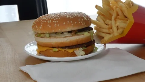 Burger with pomes on the table Stock Footage 92689697