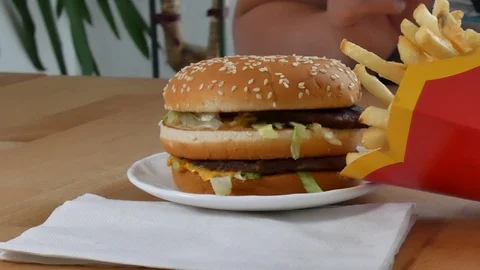 Burger with pomes on the table Stock Footage 92690173