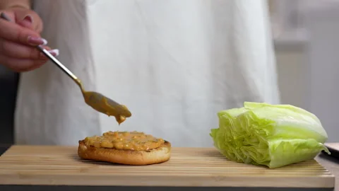 Burger-Preparation-Adding-Sauce Stock Footage 315304390