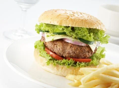 Burger with restaurant setting Stock Photos