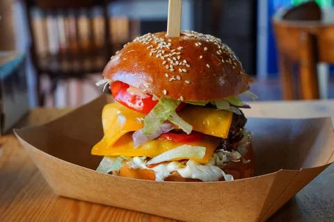 Burger on restaurant table. Stock Photos