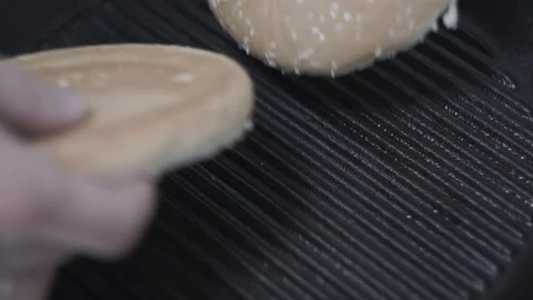 Burger rolls fried in a pan Stock Footage 106631826