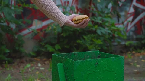 The burger is thrown into the trash. Stock Footage 116564190