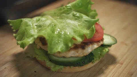 Burger with vegetables and cutlet Stock Footage 129685523