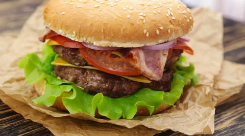 Burger on wooden table Stock Footage 64467889