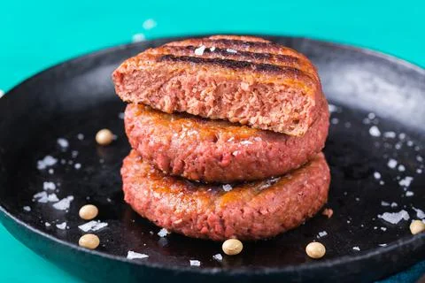Burgers made from plant based meat, food reducing carbon footprint Stock Photos