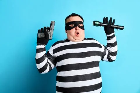 Burglar is being cought by police Stock Photos