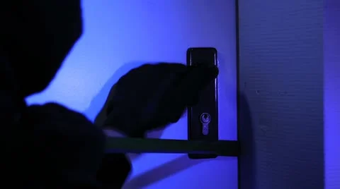 Burglar breaking a door Stock Footage 11606513