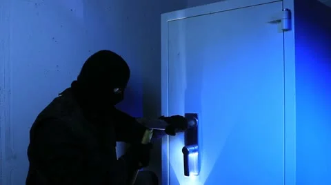 A burglar breaks open a safe - 1 Stock Footage 11607000