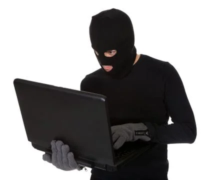 Burglar on computer 스톡 사진