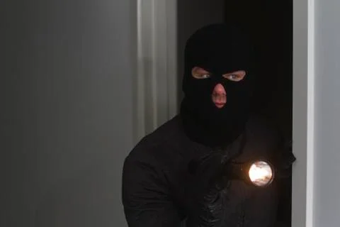 Burglar flashlight Stock Photos