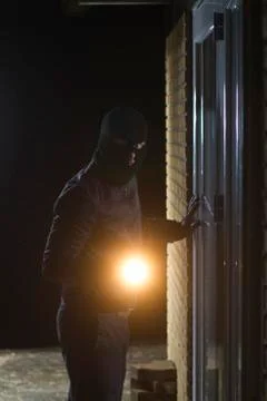 Burglar flashlight Stock Photos