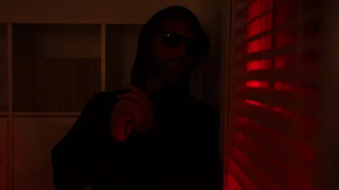 Burglar man hold guy and hide in house. Robbery crime at night. Criminal man gun Stock Footage 318976209