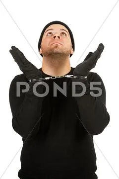 Burglar: robber wearing handcuffs Stock Photos