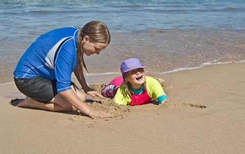 Buried at the beach Stock Photos