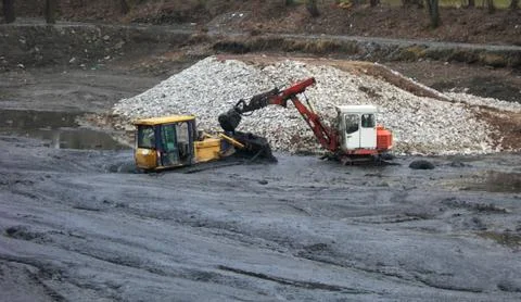 Buried excavators Stock Photos