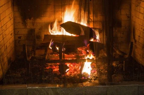 Buring fire in old fireplace Foto stock