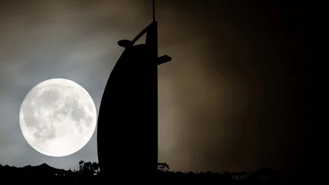 Burj Al Arab or Tower of the Arabs by Night with Full Moon, Luxury Hotel, Dubai Stock Footage 103288861