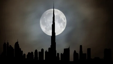 The Burj Khalifa "Khalifa Tower" by Night with Full Moon, Dubai Stock Footage 103254225