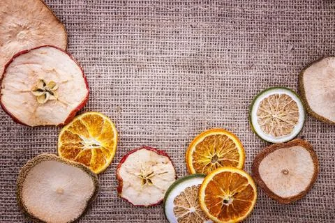 Burlap background  apple orange Stock Photos