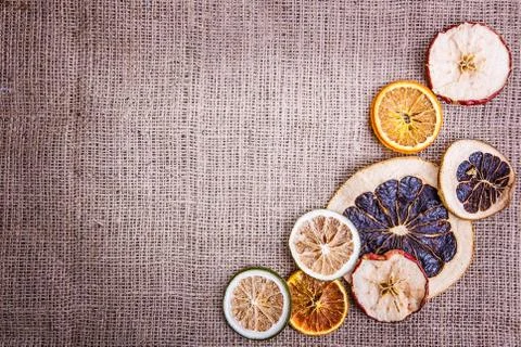 Burlap background  apple orange Stock Photos