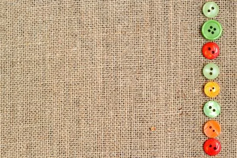 Burlap background with buttons border Stock Photos