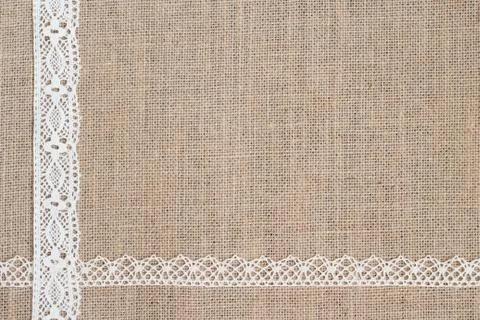 Burlap background with lace Stock Photos